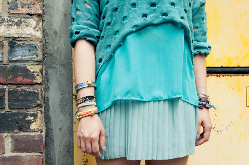 A woman's outfit in three shades of green