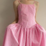 A photo of an 80s pink and white summer cotton dress.