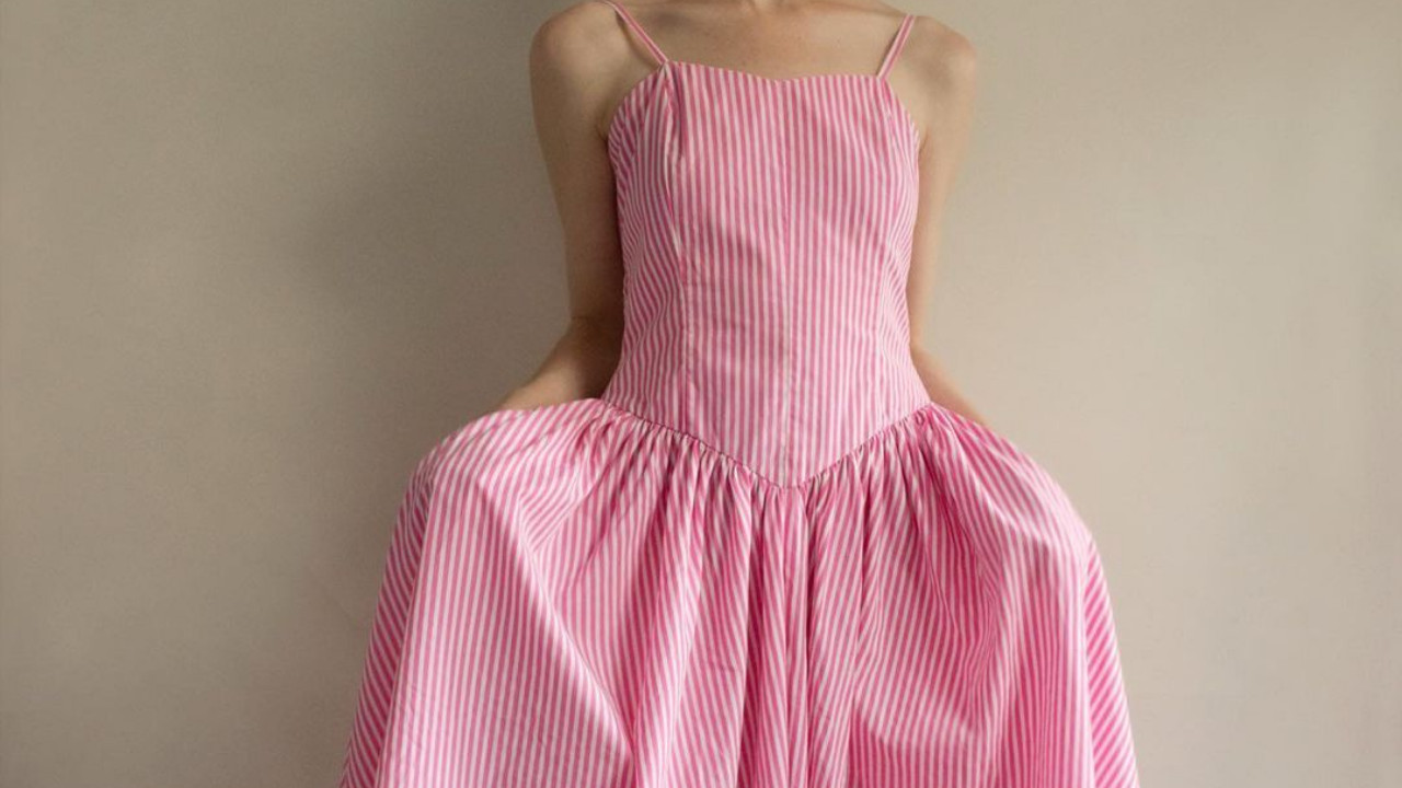 A photo of an 80s pink and white summer cotton dress.
