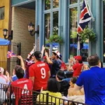 fans celebrating at Queen and Beaver