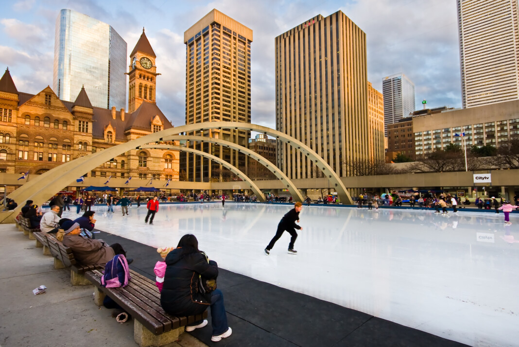 Skaters on rink at Nathan Phillips Square, Toronto