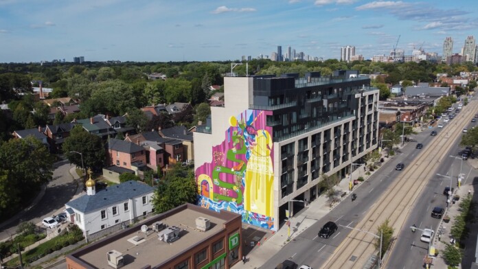 Yellow Oasis mural on St. Clair Avenue from a distance