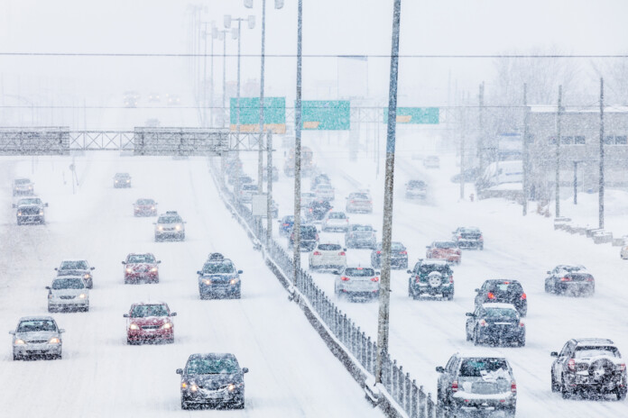 Snowstorm on the Highway during Rush Hour Snowstorm on the Highway during Rush Hour