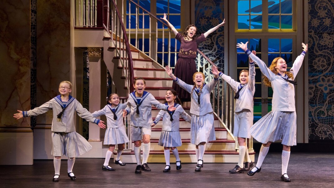 Kevin Earley (Captain Georg von Trapp) and Cayleigh Capaldi (Maria Rainer) with the von Trapp Children (l to r) Ariana Ferch (Liesl), Eli Vander Griend (Friedrich), Ava Davis (Louisa), Benjamin Stasiek (Kurt), Haddie Mac (Brigitta), Ruby Caramore (Marta), Luciana VanDette (Gretl) in 'The Sound of Music' (Photo: Jeremy Daniel)