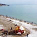 Aerial view of the Winter Stations 2022 exhibition, including The Hive by Will Cuthbert and Kathleen Dogantzis. Photo credit: Jonathan Sabeniano