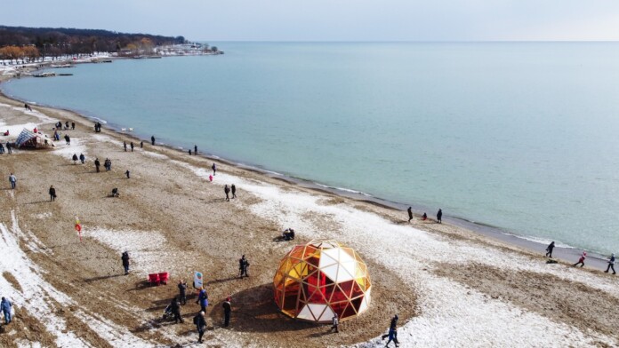 Aerial view of the Winter Stations 2022 exhibition, including The Hive by Will Cuthbert and Kathleen Dogantzis. Photo credit: Jonathan Sabeniano
