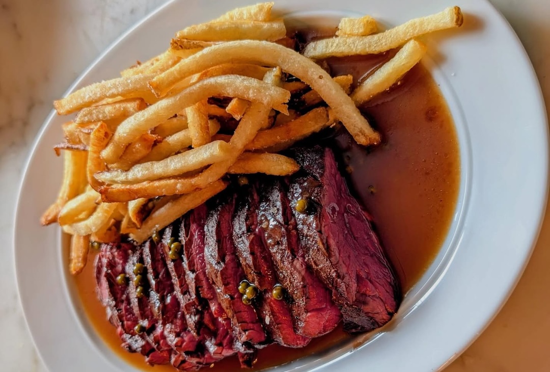 Wood-fired bavette steak frites with peppercorn jus and crunchy fries at Martines Wine Bar Little Italy.